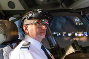 Boeing 737 Aircraft pilot operates head-up with Universal Avionics SkyLens Head-Wearable Device (HWD). (Photo courtesy of Universal Avionics)